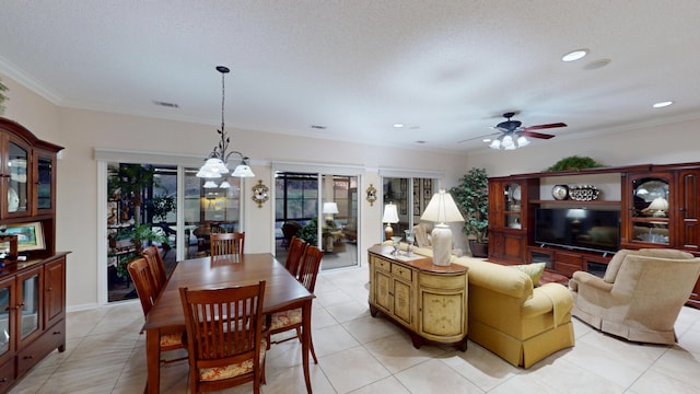 dining space with ceiling fan, light tile patterned floors, recessed lighting, and crown molding