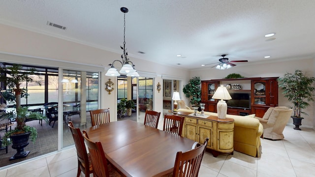 dining room with light tile patterned floors, a ceiling fan, recessed lighting, and ornamental molding