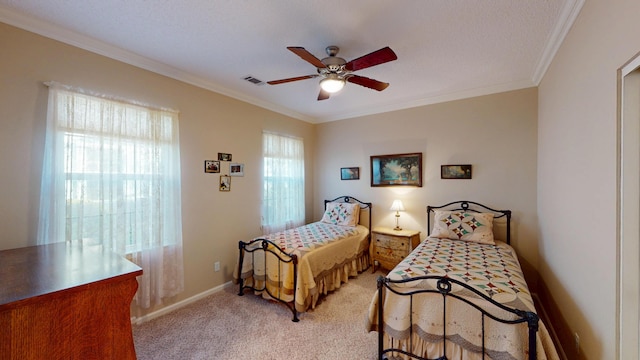 bedroom with ornamental molding, light colored carpet, and ceiling fan