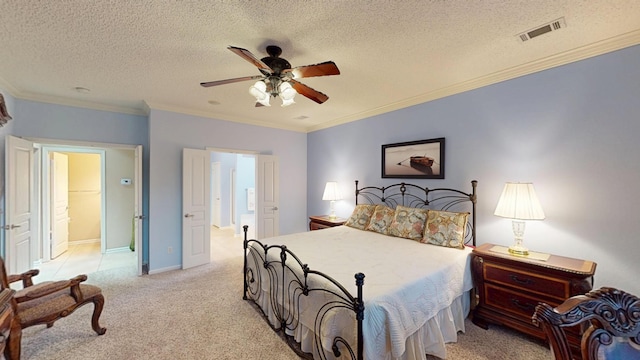 bedroom featuring light carpet, a textured ceiling, crown molding, and ceiling fan