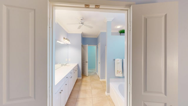 bathroom featuring vanity, ceiling fan, a bath, tile patterned floors, and crown molding
