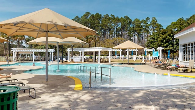 community pool featuring a pergola and a patio