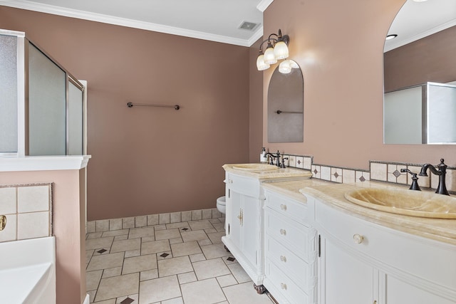 full bath featuring visible vents, toilet, ornamental molding, a shower stall, and a sink