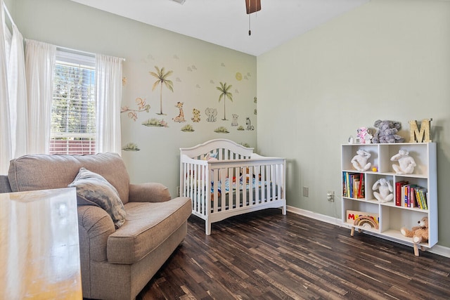 bedroom with ceiling fan, wood finished floors, and baseboards