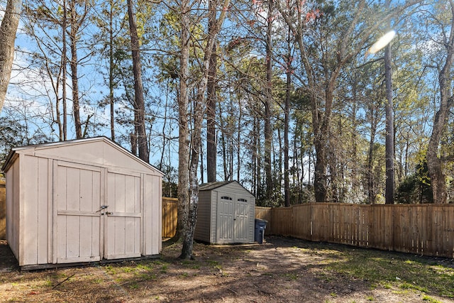 view of shed with a fenced backyard