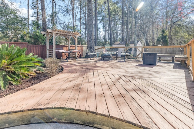 wooden terrace with fence and a pergola