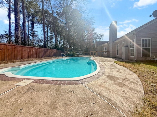 view of swimming pool with a patio, a fenced backyard, and a fenced in pool