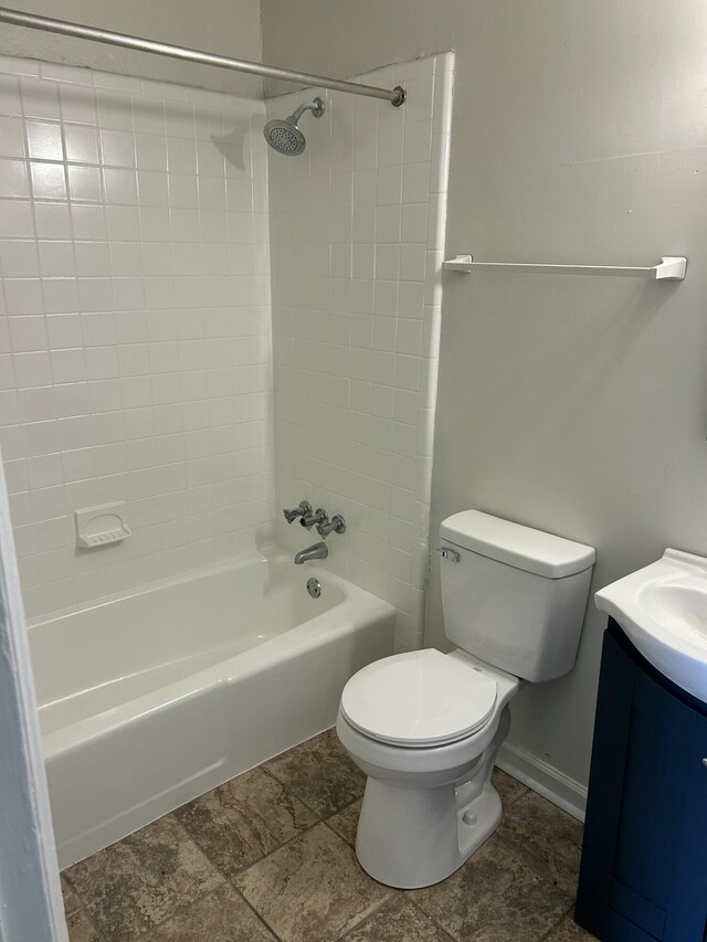 full bath with toilet, vanity, and tub / shower combination