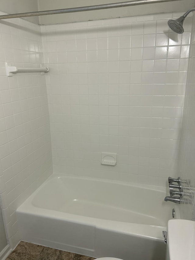 full bath featuring  shower combination and toilet
