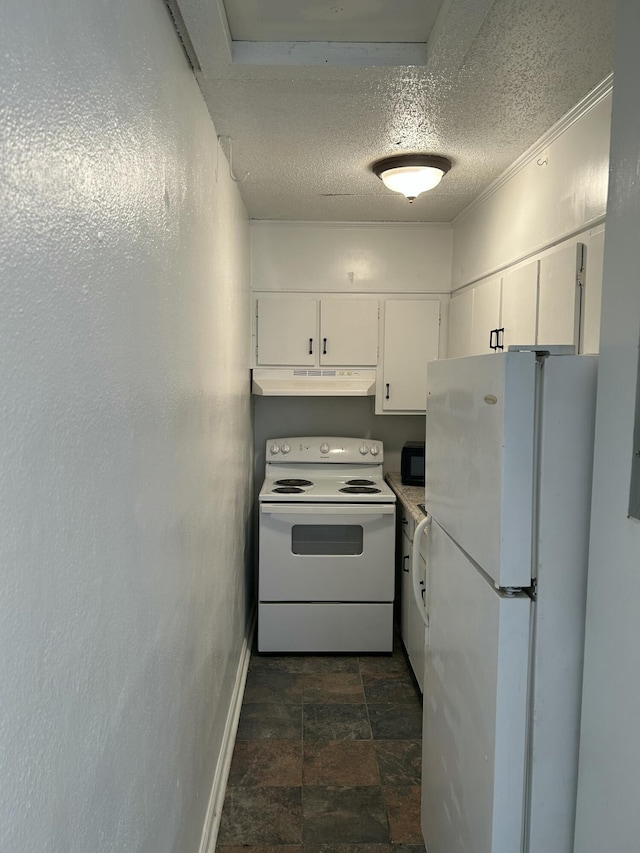 kitchen with white appliances, a textured ceiling, stone finish floor, under cabinet range hood, and baseboards