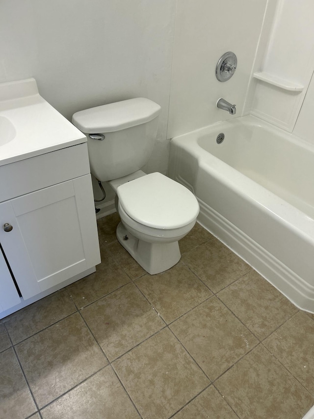 bathroom with shower / bath combination, vanity, toilet, and tile patterned floors