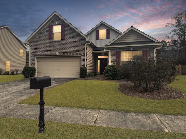 view of front facade with a lawn and a garage