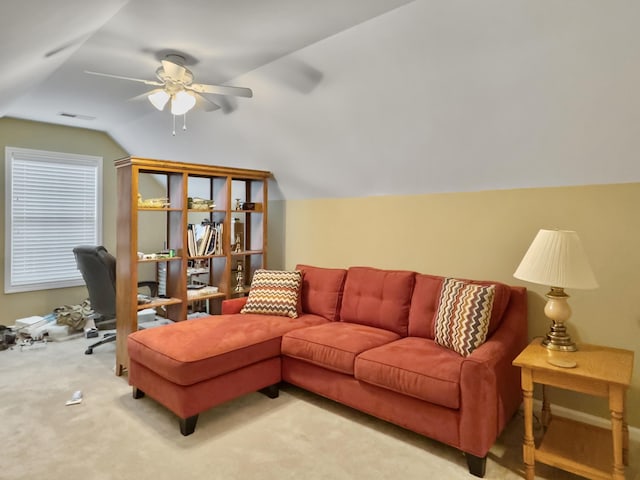 living room featuring carpet, ceiling fan, and vaulted ceiling