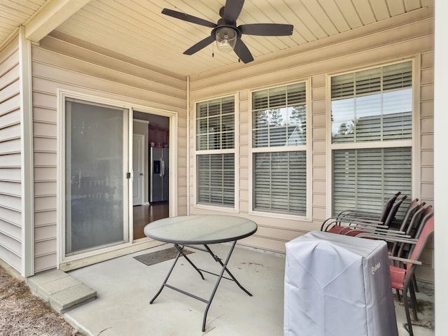 view of patio featuring a grill and ceiling fan