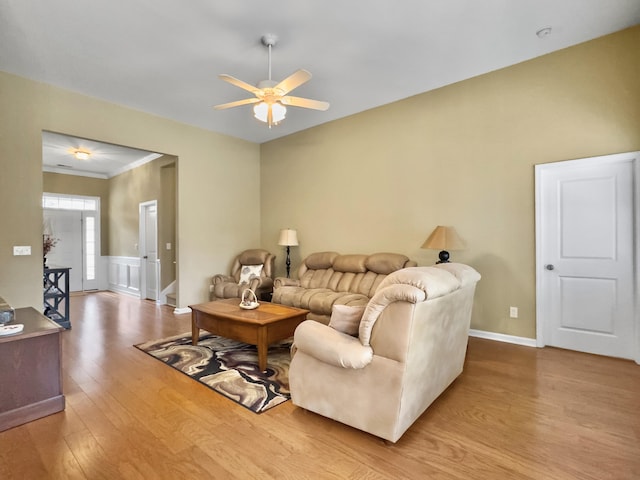 living room with ceiling fan and light hardwood / wood-style floors