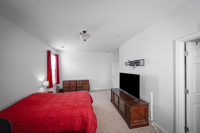 bedroom with light carpet