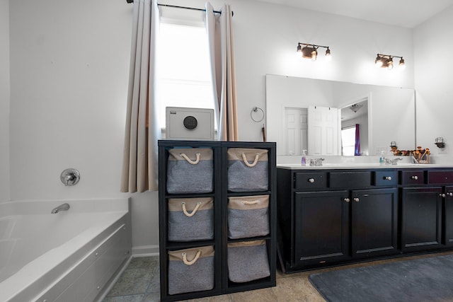 bathroom with vanity and a bathing tub