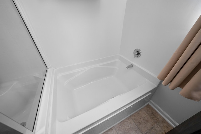 bathroom featuring tile patterned floors and plus walk in shower