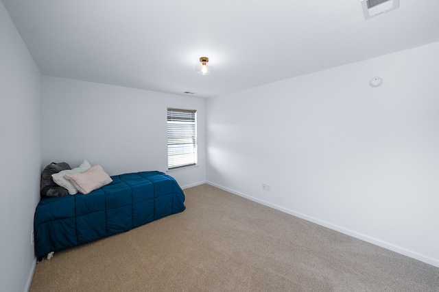 bedroom with light carpet