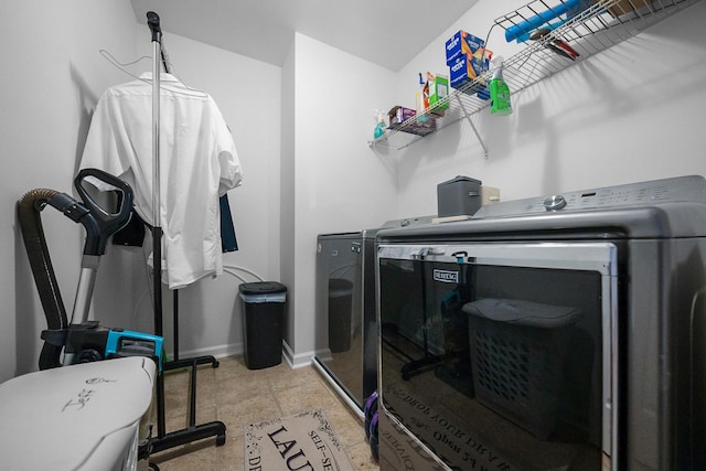 clothes washing area featuring washer and dryer