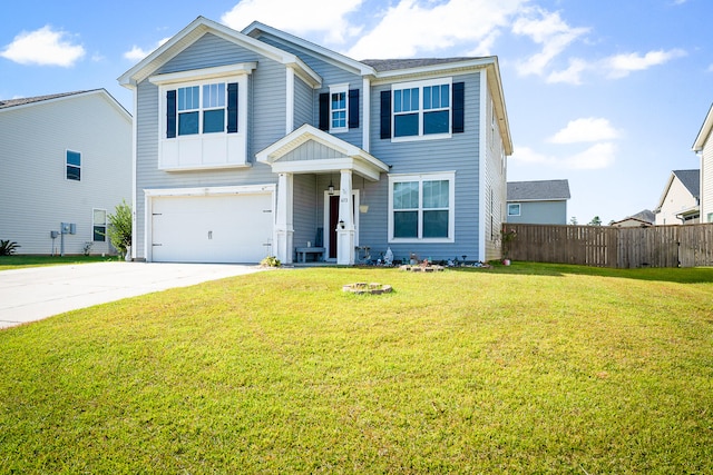 view of front of property with a garage and a front lawn