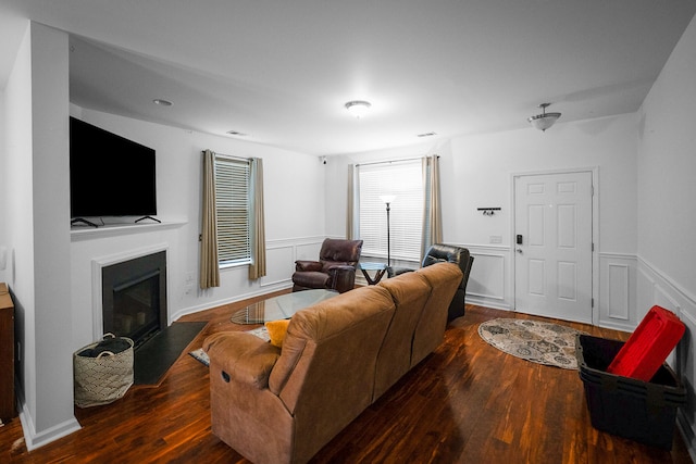 living room with dark hardwood / wood-style floors