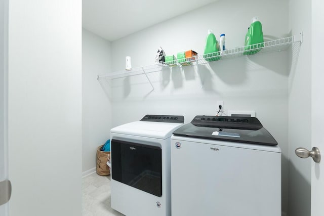 297 Red Leaf Blvd, Moncks Corner, SC 29461 - laundry area with washer and dryer, light flooring, and baseboards