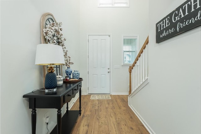 297 Red Leaf Blvd, Moncks Corner, SC 29461 - entrance foyer with wood finished floors, stairs, baseboards, and a towering ceiling