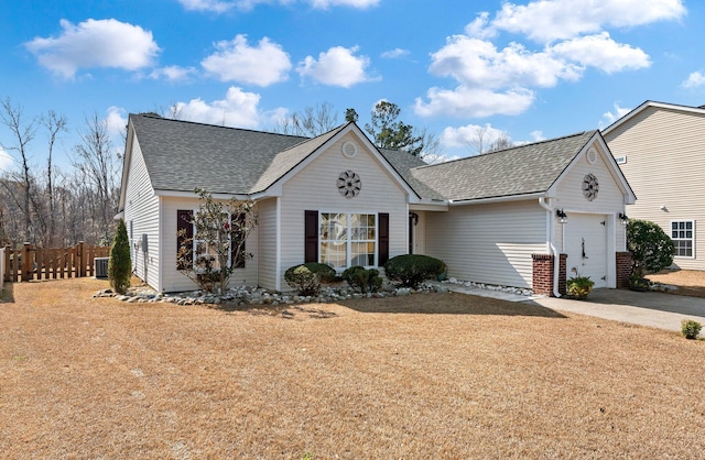 view of front of home featuring a garage and a front lawn