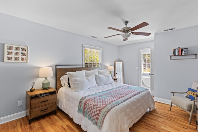 bedroom with visible vents, baseboards, light wood finished floors, and a ceiling fan