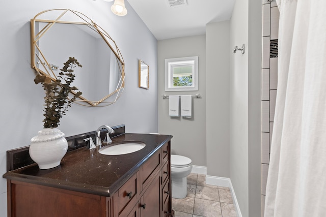 full bathroom with toilet, vanity, baseboards, and visible vents