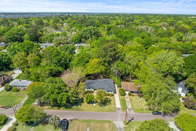 aerial view featuring a wooded view