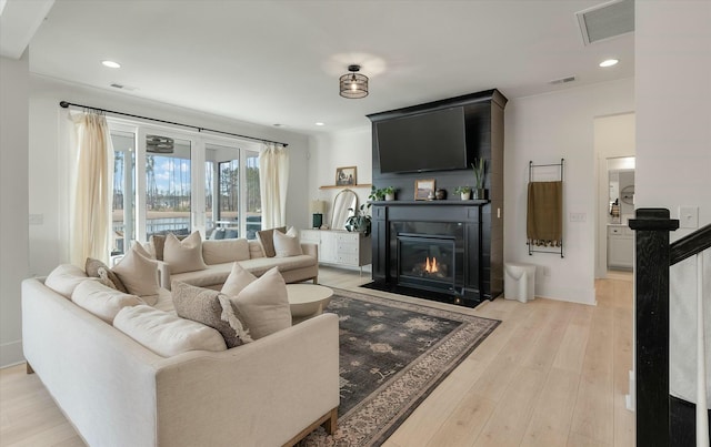 living room with light hardwood / wood-style flooring