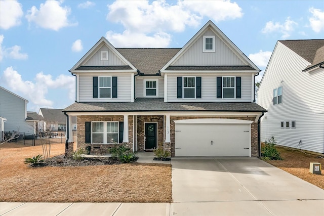 craftsman inspired home with a garage and a porch