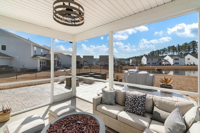 view of patio with an outdoor living space with a fire pit