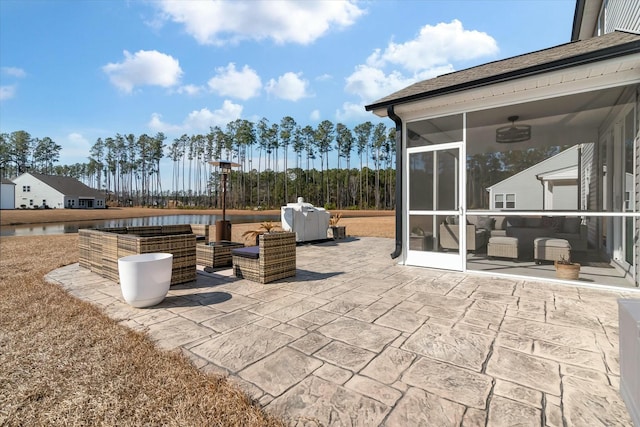 view of patio / terrace with a sunroom