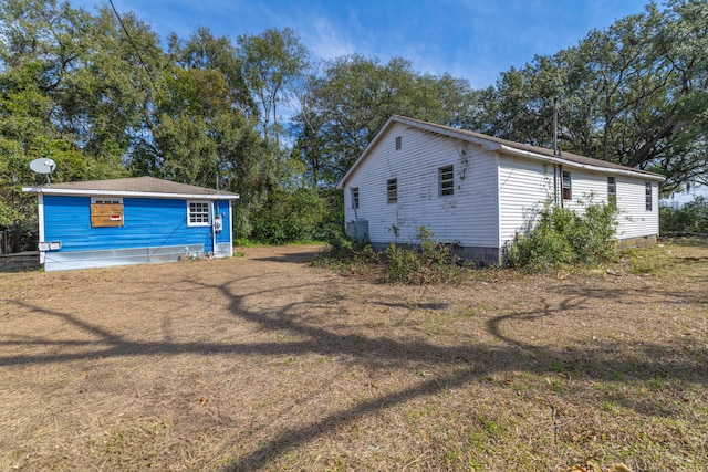 view of side of property with crawl space