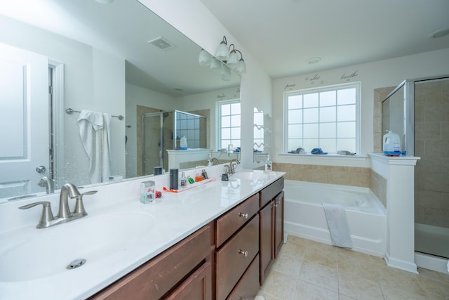 full bath with tile patterned floors, a stall shower, visible vents, and a sink