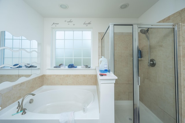 full bathroom with a garden tub and a shower stall