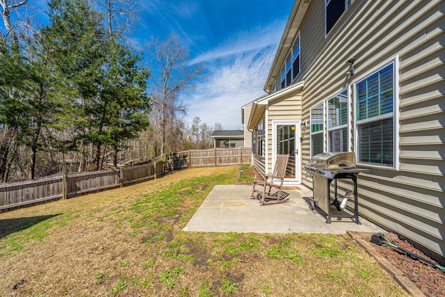 view of yard with a patio and a fenced backyard