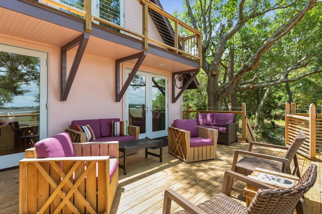 wooden deck featuring outdoor lounge area and french doors