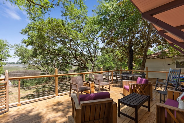 wooden deck featuring outdoor lounge area