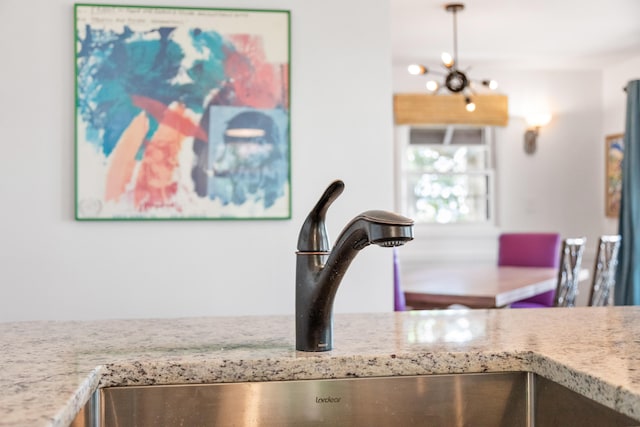 interior details with an inviting chandelier and sink