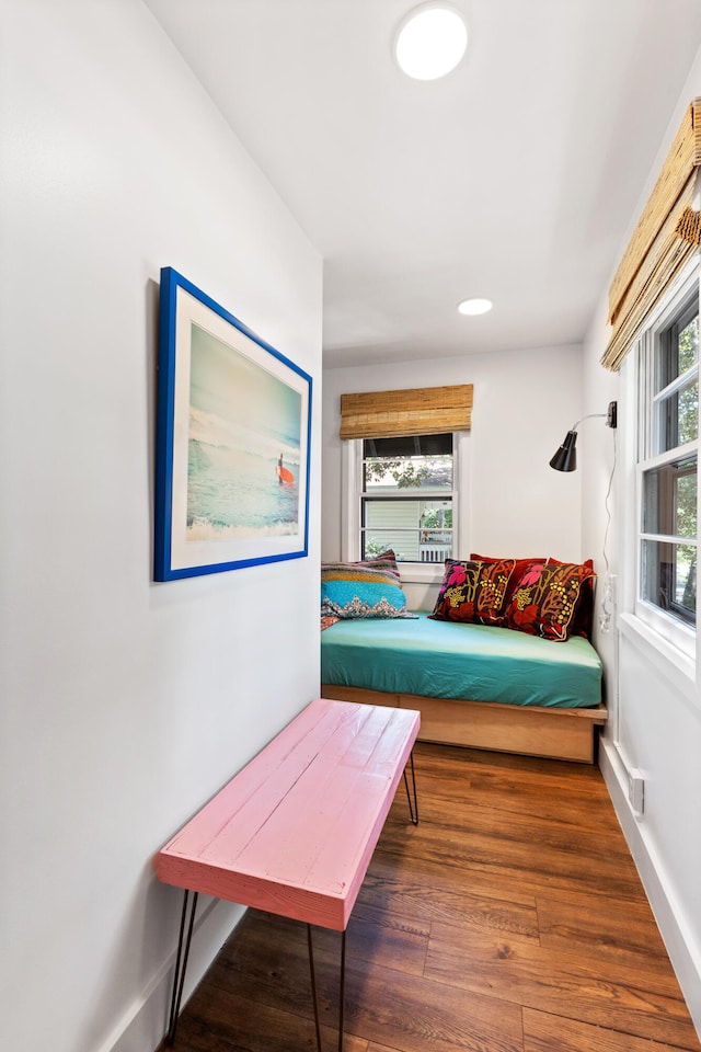 sitting room featuring dark hardwood / wood-style floors and a healthy amount of sunlight