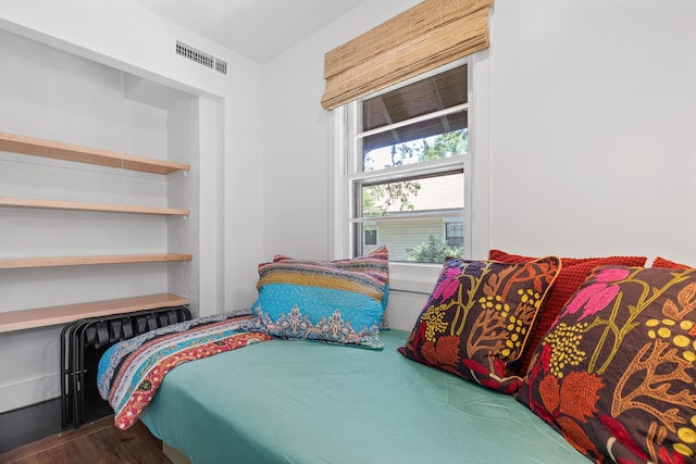 bedroom with hardwood / wood-style flooring