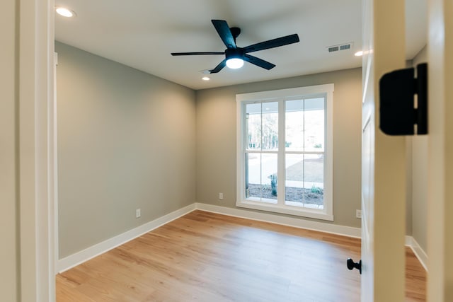 unfurnished room with visible vents, baseboards, recessed lighting, light wood-style flooring, and a ceiling fan