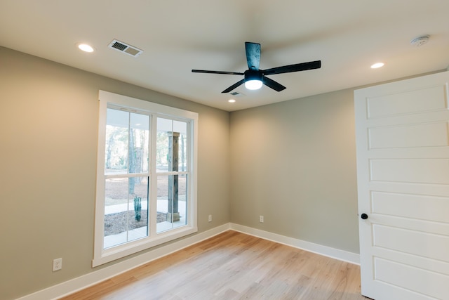 unfurnished room with a ceiling fan, visible vents, baseboards, recessed lighting, and light wood-style floors