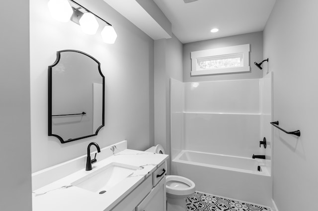 bathroom with vanity, toilet, and shower / tub combination