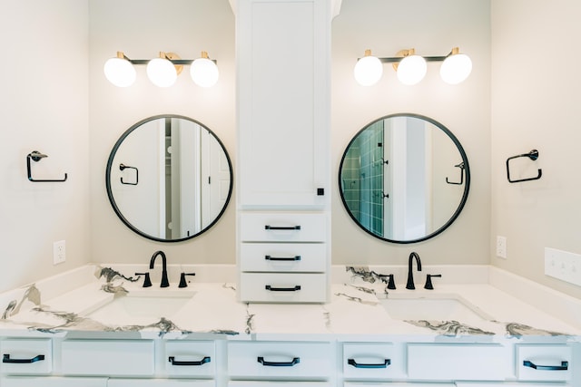 full bath featuring double vanity and a sink