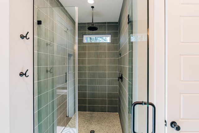 bathroom with a shower stall